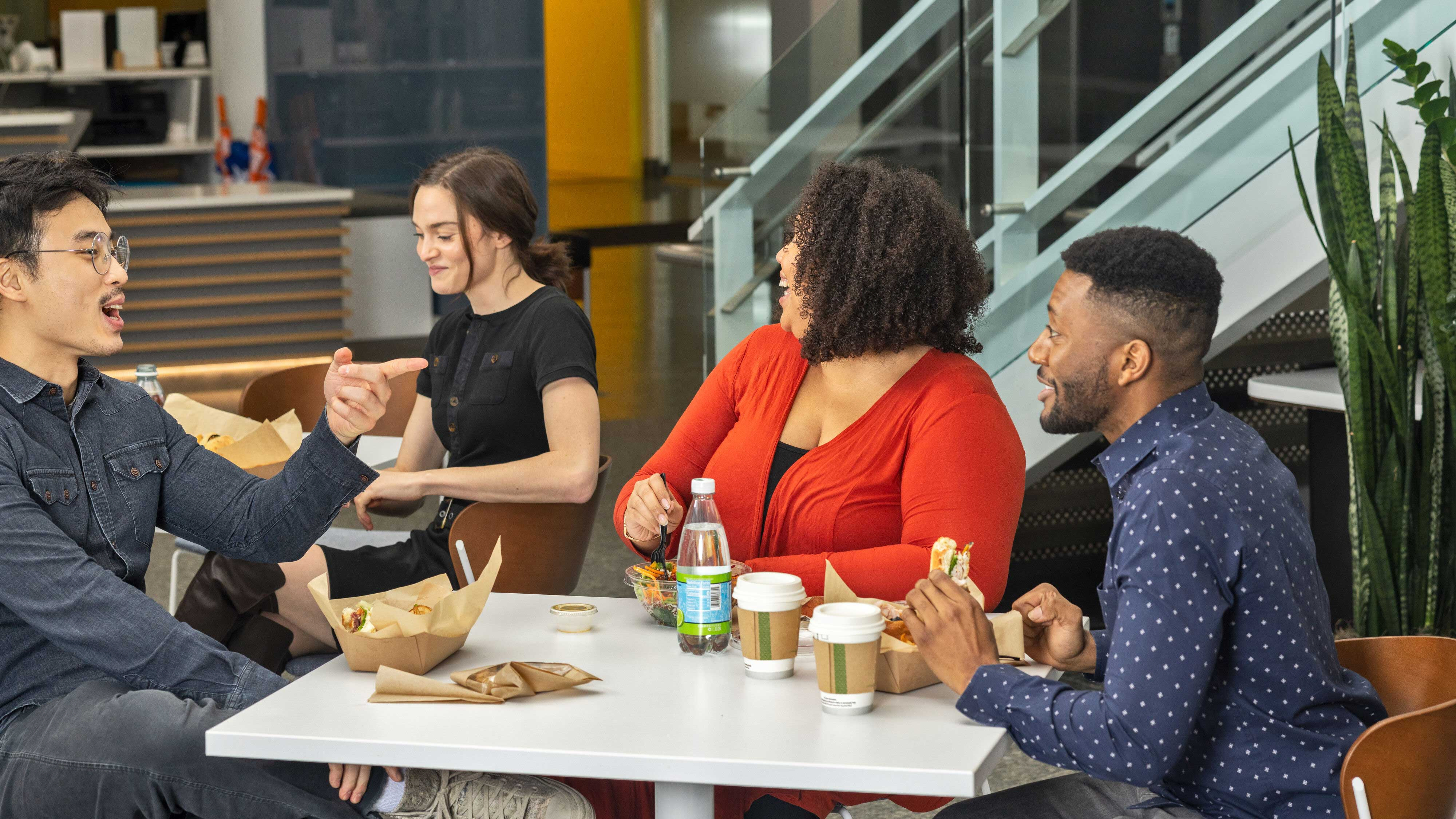 Group of individuals enjoying meal in cafe